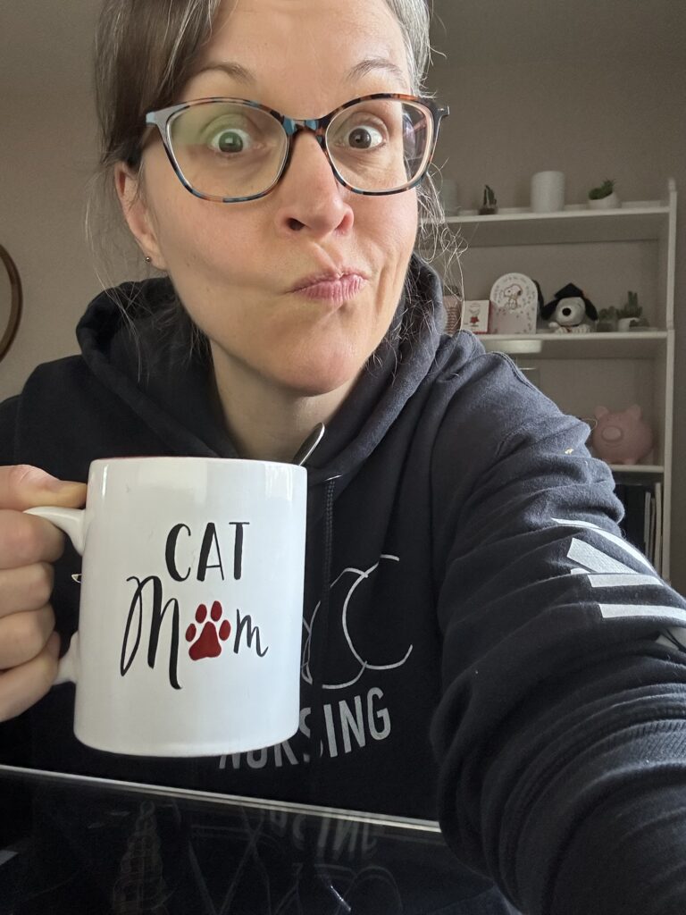 Kristen holding a mug.